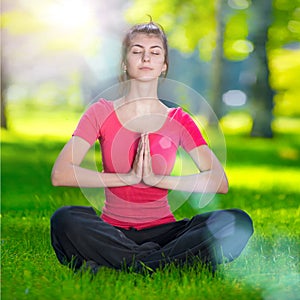 Young woman doing yoga exercises