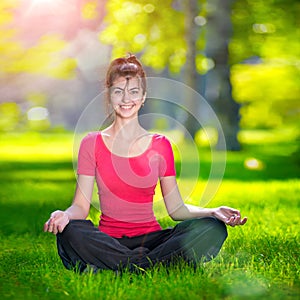 Young woman doing yoga exercises