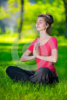 Young woman doing yoga exercises