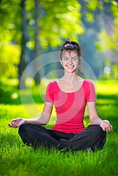 Young woman doing yoga exercises