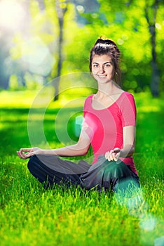 Young woman doing yoga exercises