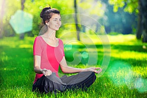 Young woman doing yoga exercises