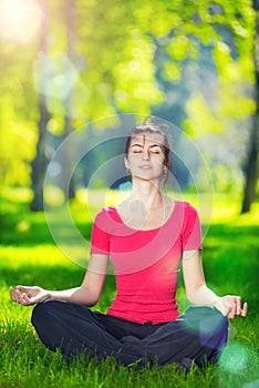 Young woman doing yoga exercises