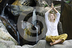 Young woman doing yoga exercises