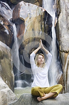 Young woman doing yoga exercises