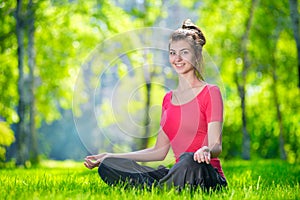 Young woman doing yoga exercises