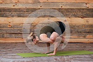 Young woman doing yoga exercises