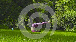 Young woman doing yoga exercises