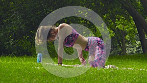 Young woman doing yoga exercises