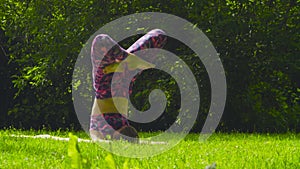 Young woman doing yoga exercises