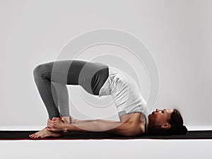 Young woman doing yoga exercises.healthy fit sport girl