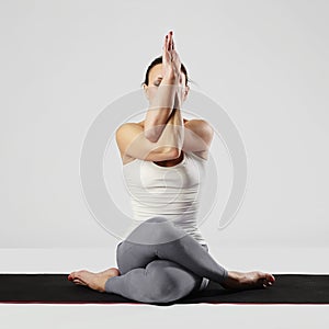Young woman doing yoga exercises.healthy sport girl