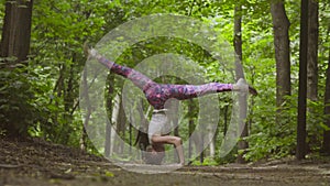 Young woman doing yoga exercises in the park