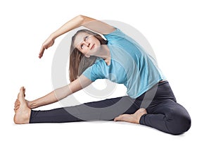 young woman doing yoga exercises. studio photo