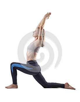 young woman doing yoga exercises. studio photo