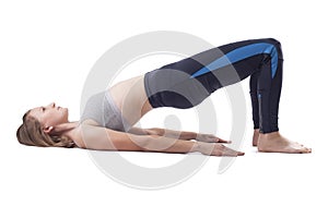 young woman doing yoga exercises. studio photo