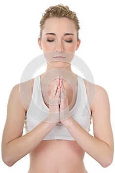 Young woman doing yoga, meditation, eyes closed