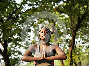 Young woman doing yoga in the park