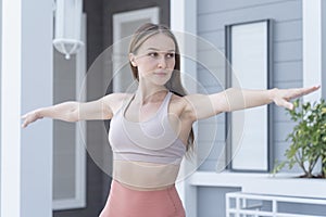 Young woman doing yoga and Pilates outdoor with her mat. Beautiful female happy doing exercise and working out