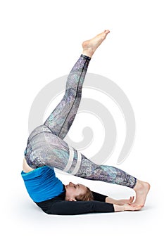 Young woman doing yoga practice isolated on white background. Concept of healthy life and natural balance between body and mental