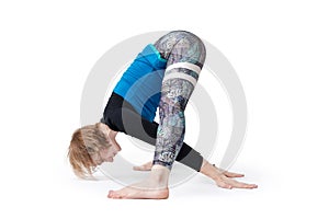 Young woman doing yoga practice isolated on white background. Concept of healthy life and natural balance between body and mental