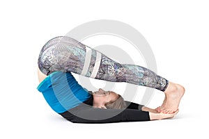 Young woman doing yoga practice isolated on white background. Concept of healthy life and natural balance between body and mental