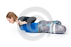 Young woman doing yoga practice isolated on white background. Concept of healthy life and natural balance between body and mental