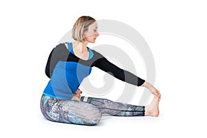 Young woman doing yoga practice isolated on white background. Concept of healthy life and natural balance between body and mental