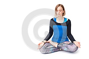 Young woman doing yoga practice isolated on white background. Concept of healthy life and natural balance between body and mental