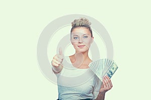 Young woman with dollar notes in her hand. on white background