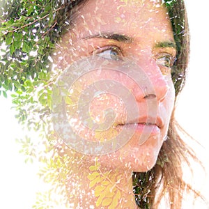 Young woman double exposure portrait with leaves