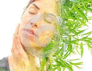 Young woman double exposure portrait with leaves