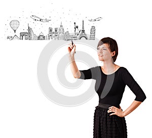 Young woman drawing famous cities and landmarks on whiteboard