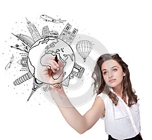 Young woman drawing a globe on whiteboard
