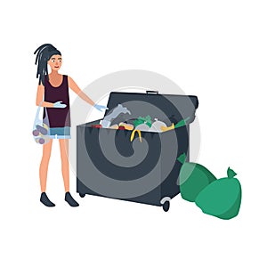 Young woman with dreadlocks picking leftover food from garbage container or trash bin. Female freegan dumpster diving