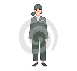 Young woman dressed in prison uniform isolated on white background. Female prisoner, convicted criminal, arrested or photo