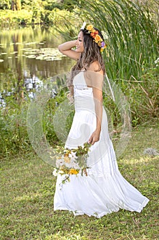 Young Woman Staring In The Distance, By A Lake