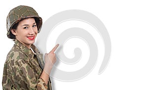 Young woman dressed in wwii military uniform with helmet showing empty blank signboard with copyspace