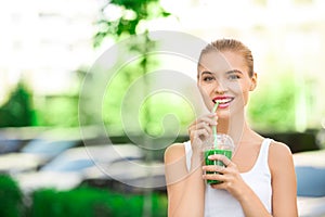 Young woman drink smoothie healthy detox outdoors