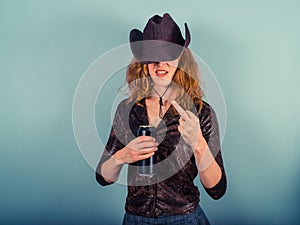Young woman drinking and being rude