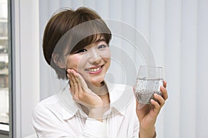 Young woman drinking chia seeds