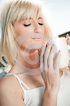Young woman drinking coffee