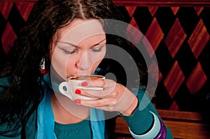 Young woman drinking coffee