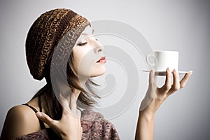 Young woman drinking coffee