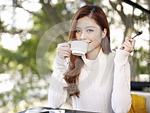 Young woman drinking coffee