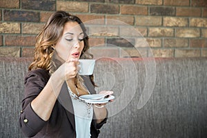 Young Woman Drinking Coffee