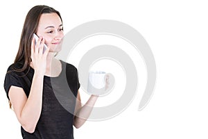 Young woman drinking coffee and using her mobile phone in white background and copy space