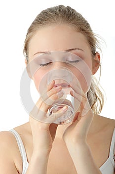 Young woman drinking fresh cold water