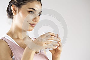 Young woman drinking glass of water