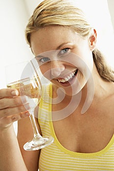 Young Woman Drinking A Glass Of Wine